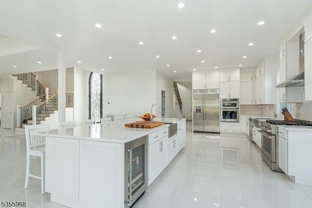 34 W Shore Rd, Mountain Lakes Boro, NJ 07046 - kitchen with high quality appliances, wall chimney range hood, wine cooler, a sink, and recessed lighting