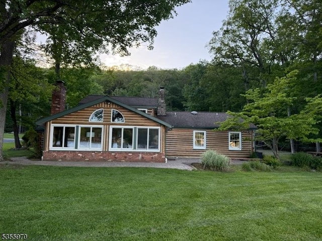 217 Bearfort Rd, West Milford Twp, NJ 07480 - back of house featuring a chimney and a lawn