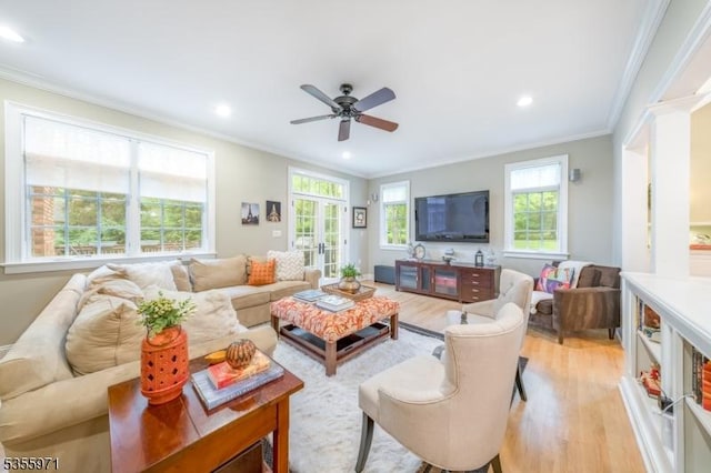 living area featuring ornamental molding, light wood-style floors, a ceiling fan, and recessed lighting