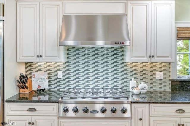 kitchen with extractor fan, stainless steel gas cooktop, decorative backsplash, and white cabinets