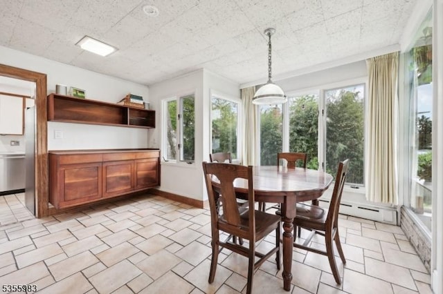 10 Highland Pl, West Orange Twp, NJ 07052 - dining room with plenty of natural light, a baseboard radiator, and baseboards