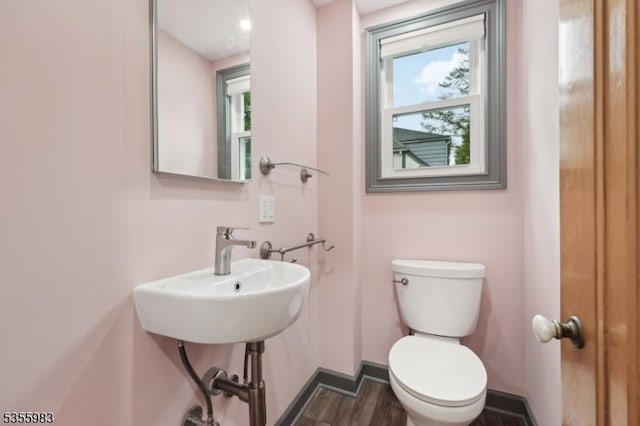 10 Highland Pl, West Orange Twp, NJ 07052 - bathroom with toilet, baseboards, wood finished floors, and a sink