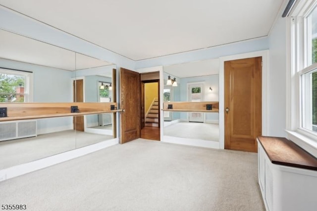 10 Highland Pl, West Orange Twp, NJ 07052 - interior space with carpet flooring, stairway, and radiator heating unit