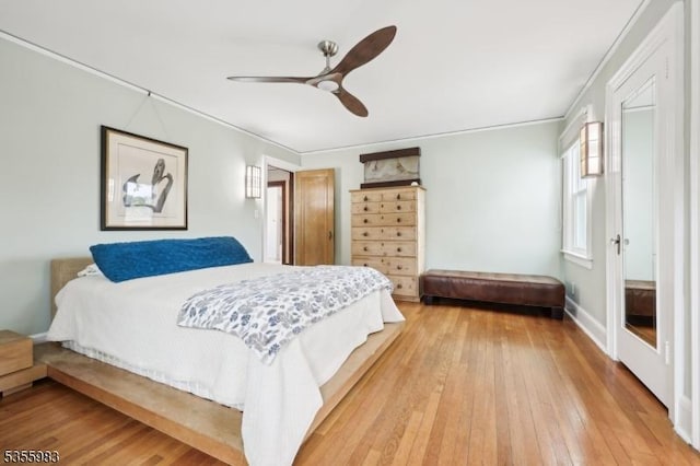 10 Highland Pl, West Orange Twp, NJ 07052 - bedroom with light wood-type flooring, ornamental molding, and ceiling fan