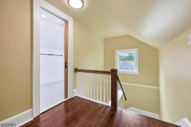 10 Highland Pl, West Orange Twp, NJ 07052 - hallway featuring an upstairs landing, dark wood-style floors, and vaulted ceiling