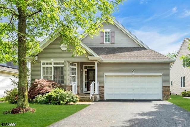 27 Jays Cor, Franklin Twp, NJ 08873 - view of front of home with stone siding, asphalt driveway, a garage, and a front lawn