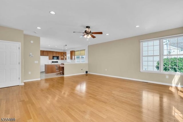 27 Jays Cor, Franklin Twp, NJ 08873 - unfurnished living room featuring a ceiling fan, recessed lighting, and light wood-style floors