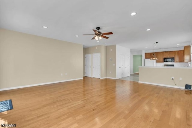 27 Jays Cor, Franklin Twp, NJ 08873 - unfurnished living room featuring light wood finished floors, a ceiling fan, and recessed lighting