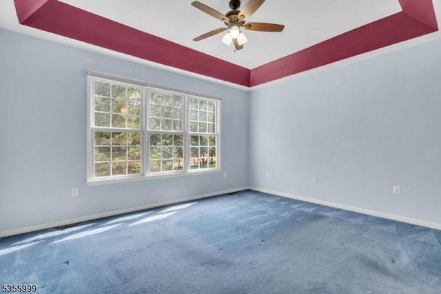 27 Jays Cor, Franklin Twp, NJ 08873 - empty room featuring a tray ceiling, carpet floors, and a ceiling fan