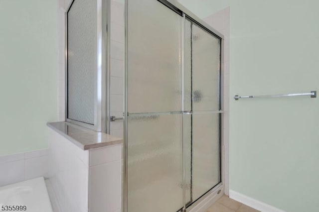 27 Jays Cor, Franklin Twp, NJ 08873 - bathroom with a stall shower, a bath, and tile patterned flooring