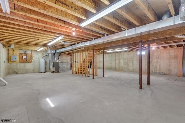 27 Jays Cor, Franklin Twp, NJ 08873 - unfinished below grade area featuring heating unit, gas water heater, and stairway