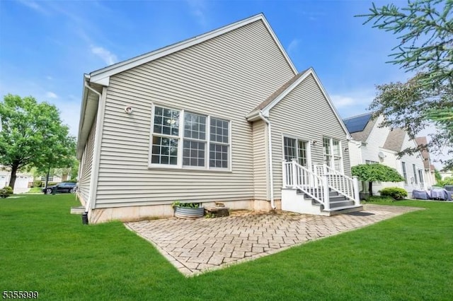 27 Jays Cor, Franklin Twp, NJ 08873 - back of property with a patio area and a yard