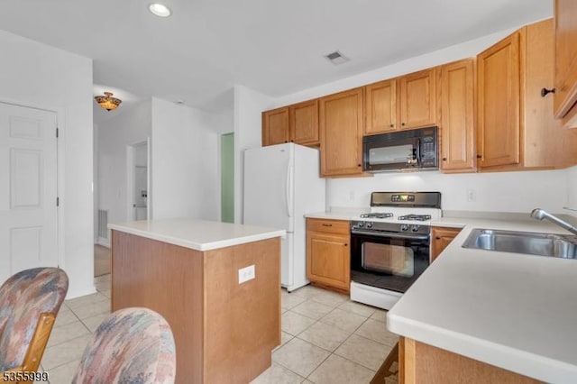 27 Jays Cor, Franklin Twp, NJ 08873 - kitchen with white appliances, a kitchen island, light tile patterned flooring, light countertops, and recessed lighting