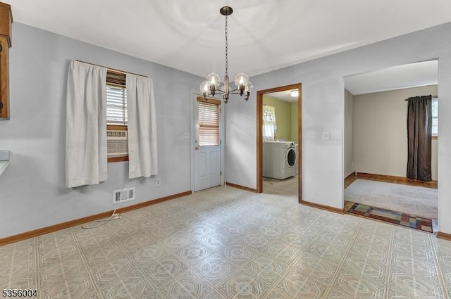 45 Ninth St, Hillsborough Twp, NJ 08821 - empty room featuring washer / clothes dryer, healthy amount of natural light, and a chandelier