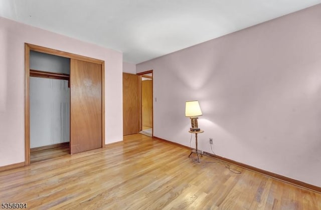 45 Ninth St, Hillsborough Twp, NJ 08821 - unfurnished bedroom with wood finished floors and a closet