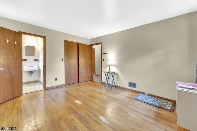 45 Ninth St, Hillsborough Twp, NJ 08821 - unfurnished bedroom with light wood finished floors and ensuite bath