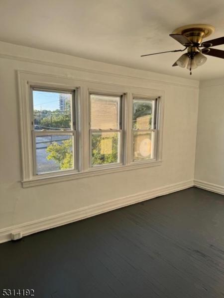 5 Franklin Blvd, Franklin Twp, NJ 08873 - spare room featuring baseboards, ceiling fan, and dark wood-style floors