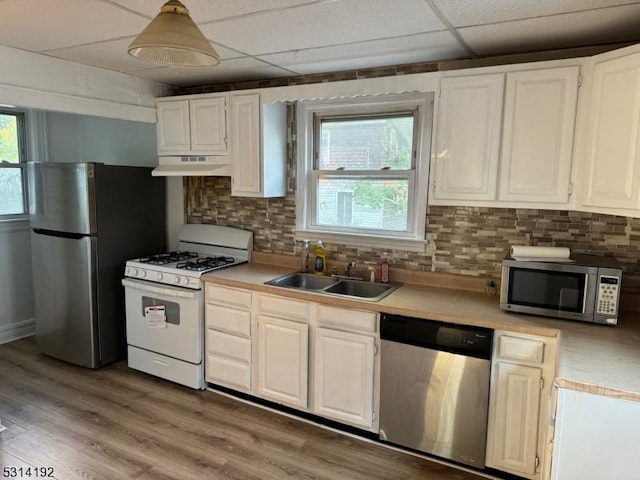 5 Franklin Blvd, Franklin Twp, NJ 08873 - kitchen featuring appliances with stainless steel finishes, under cabinet range hood, light countertops, a paneled ceiling, and white cabinetry
