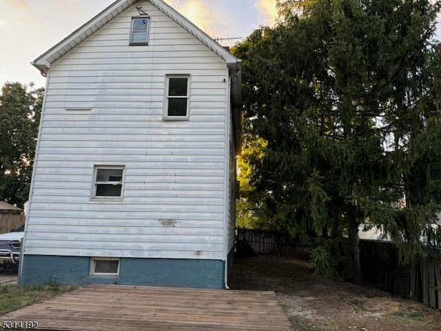 5 Franklin Blvd, Franklin Twp, NJ 08873 - property exterior at dusk featuring a fenced backyard and a wooden deck