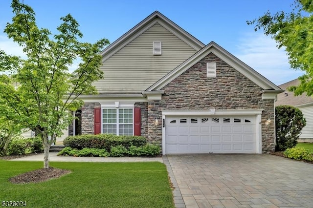 326 Biltmore Ln, Franklin Twp, NJ 08873 - view of front facade with stone siding, driveway, a garage, and a front yard