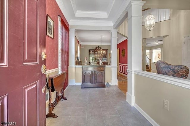 326 Biltmore Ln, Franklin Twp, NJ 08873 - foyer with a chandelier, ornate columns, light tile patterned floors, ornamental molding, and baseboards