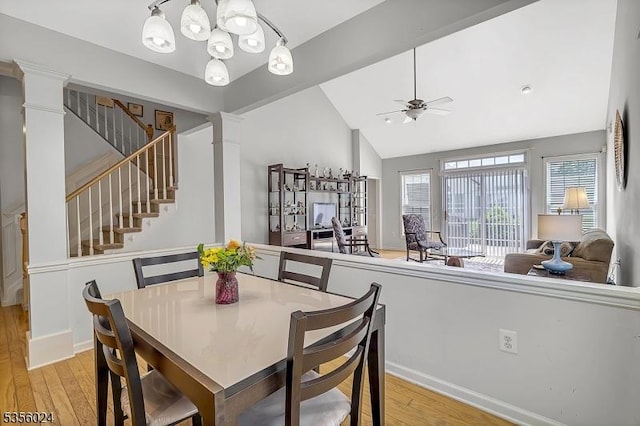 326 Biltmore Ln, Franklin Twp, NJ 08873 - dining area with light wood-style flooring, vaulted ceiling, stairs, decorative columns, and ceiling fan