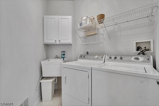 326 Biltmore Ln, Franklin Twp, NJ 08873 - laundry area featuring cabinet space, separate washer and dryer, and light tile patterned flooring