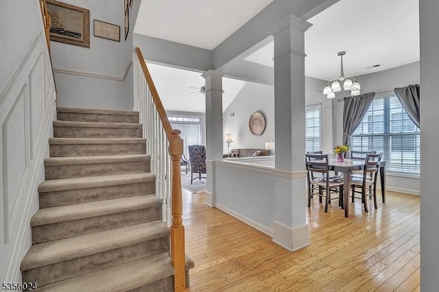 326 Biltmore Ln, Franklin Twp, NJ 08873 - stairway featuring wood-type flooring, ceiling fan, baseboards, a chandelier, and ornate columns