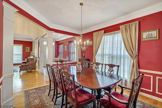 326 Biltmore Ln, Franklin Twp, NJ 08873 - dining room featuring ornate columns, light wood-style floors, a chandelier, and crown molding