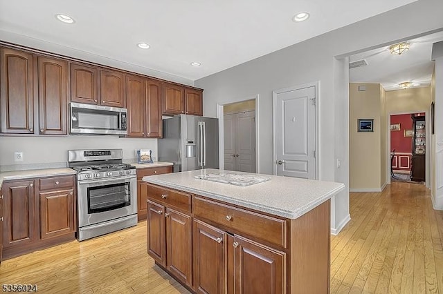 326 Biltmore Ln, Franklin Twp, NJ 08873 - kitchen featuring stainless steel appliances, light wood-type flooring, light countertops, a kitchen island, and recessed lighting