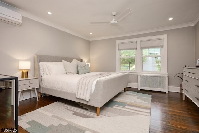 bedroom with radiator heating unit, an AC wall unit, crown molding, wood finished floors, and recessed lighting