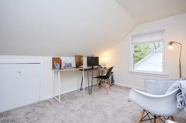 office area with vaulted ceiling, carpet floors, and baseboards