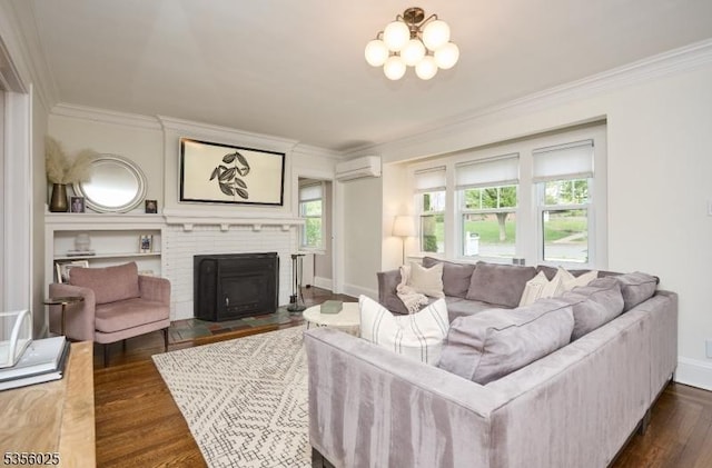 living room featuring a wall mounted AC, ornamental molding, dark wood-style floors, a brick fireplace, and baseboards