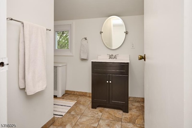 bathroom featuring baseboards, vanity, and tile patterned flooring