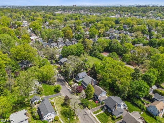 aerial view of property's location with nearby suburban area