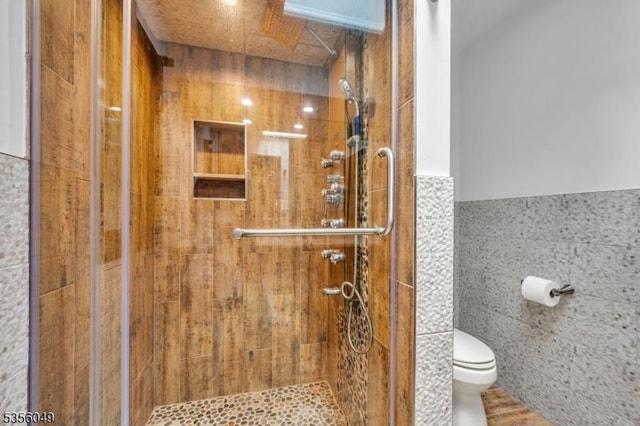 142 Decker Rd, Rockaway Twp, NJ 07005 - bathroom with tile walls, a shower stall, and a wainscoted wall