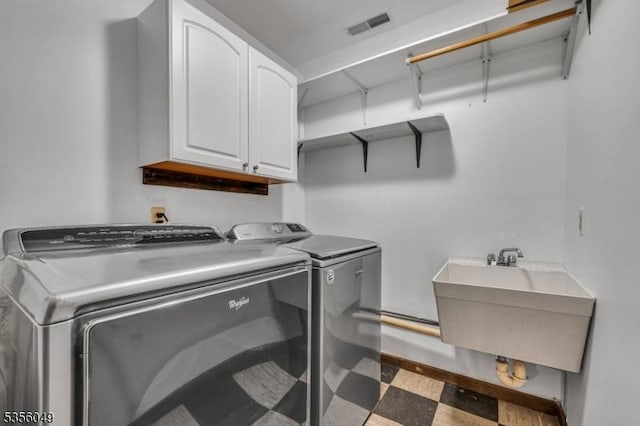 142 Decker Rd, Rockaway Twp, NJ 07005 - washroom featuring cabinet space, washing machine and dryer, and tile patterned floors