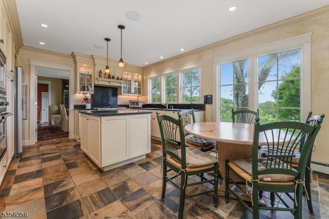 12 Woodland Rd, Franklin Twp, NJ 08867 - kitchen with dark countertops, healthy amount of natural light, glass insert cabinets, ornamental molding, and stone tile flooring