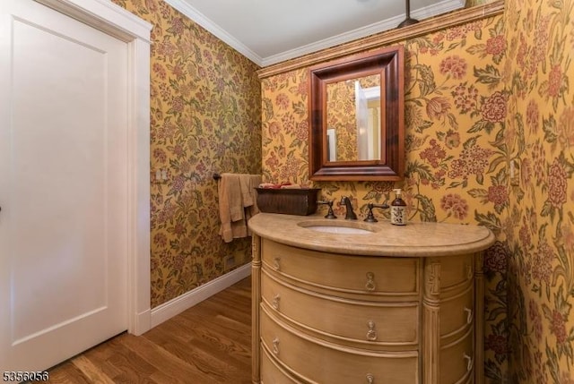 12 Woodland Rd, Franklin Twp, NJ 08867 - bathroom with wood finished floors, vanity, wallpapered walls, baseboards, and crown molding