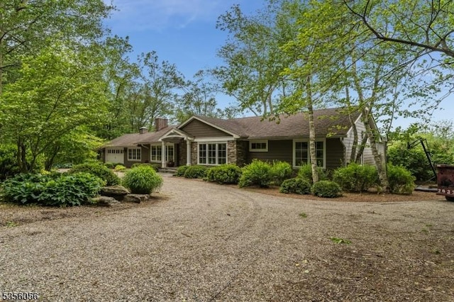 12 Woodland Rd, Franklin Twp, NJ 08867 - ranch-style home featuring a garage, driveway, and a chimney