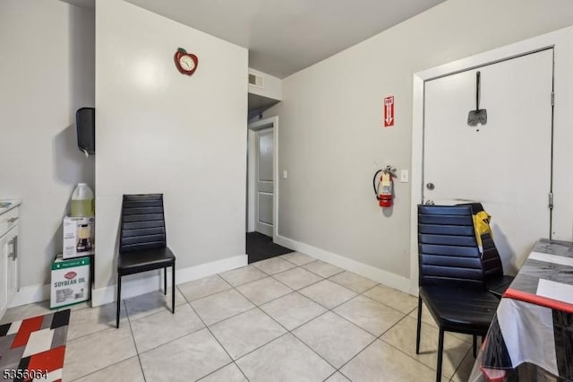 office with light tile patterned floors and baseboards