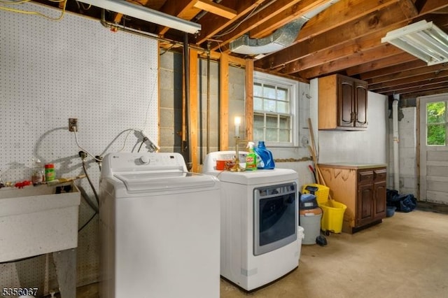 laundry area with independent washer and dryer