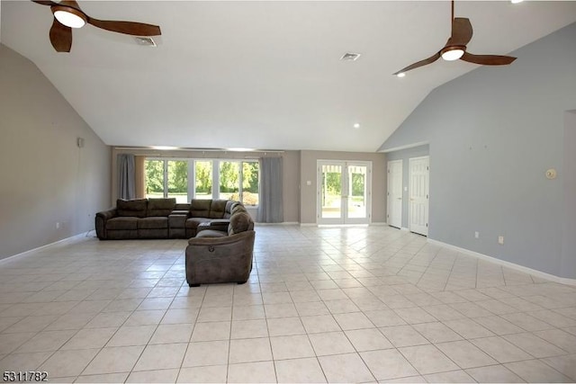 living room with a ceiling fan, light tile patterned flooring, baseboards, and high vaulted ceiling