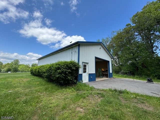 23 Ivan Rd, Knowlton Twp, NJ 07832 - view of property exterior featuring an outbuilding, a garage, and a yard