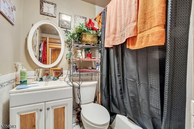 124 E Main St, Paterson City, NJ 07522 - bathroom with toilet, vanity, and tile walls