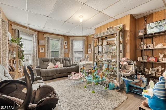 124 E Main St, Paterson City, NJ 07522 - living area with wood walls, wood finished floors, and a paneled ceiling