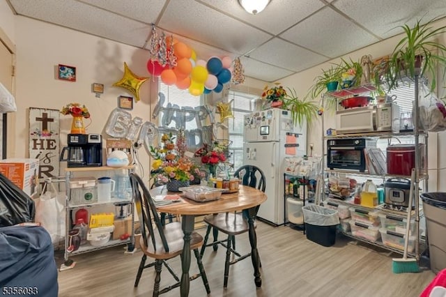 124 E Main St, Paterson City, NJ 07522 - dining space featuring a paneled ceiling and light wood-style floors