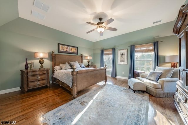 bedroom with wood finished floors, baseboards, and a ceiling fan