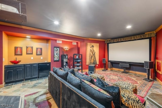 home theater room featuring recessed lighting, bar area, crown molding, and baseboards
