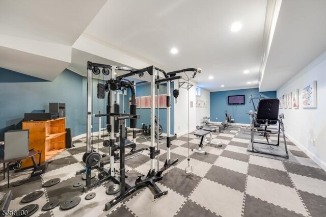 workout area featuring baseboards and recessed lighting